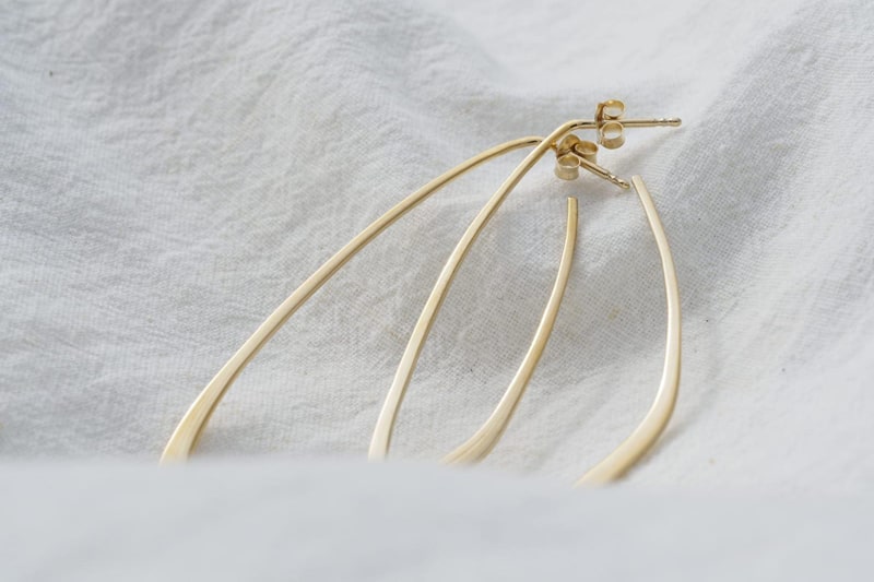 Gold sustainable ethical conscious bridal flow tide earrings styling image