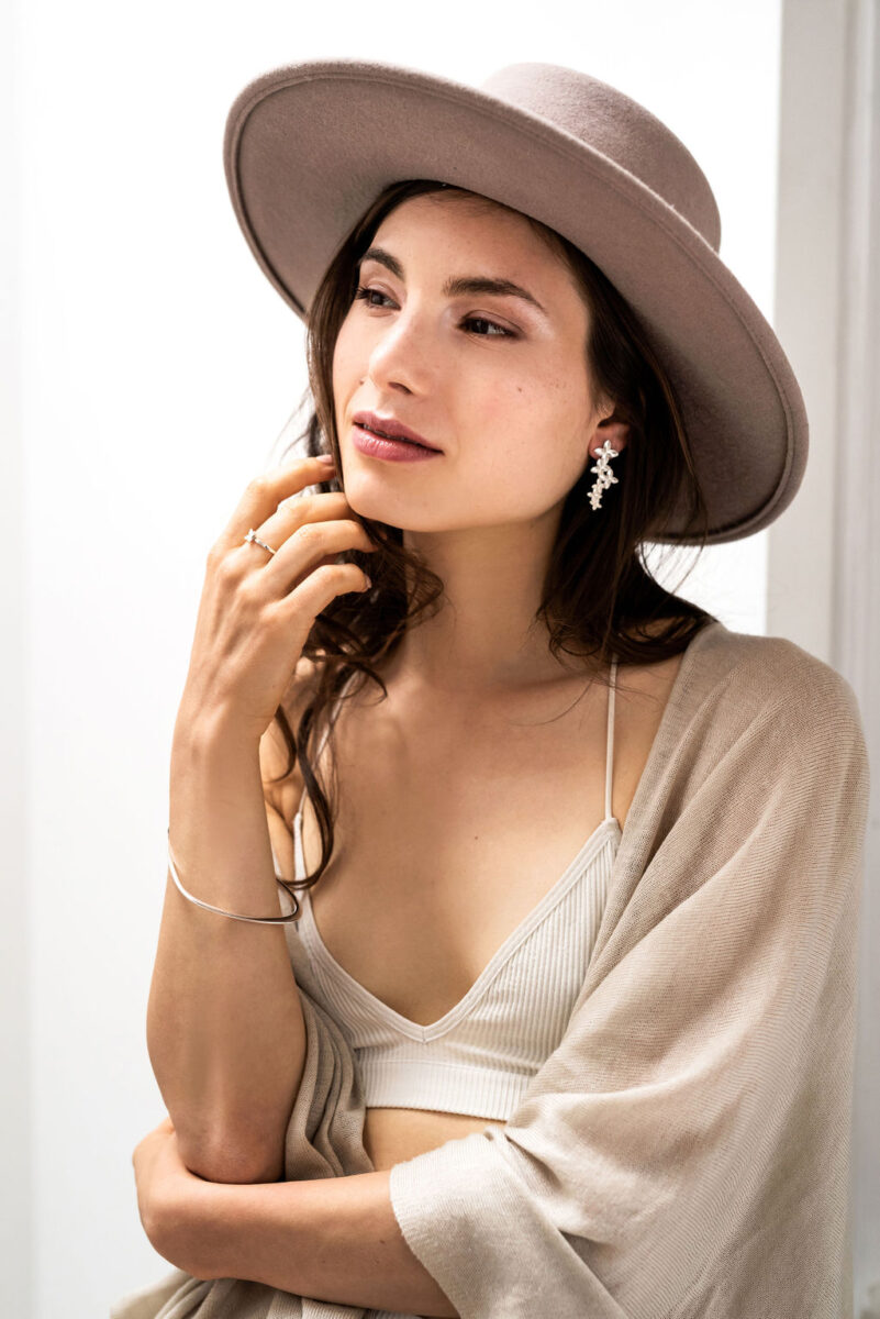 Model wearing sustainable floral mist earrings